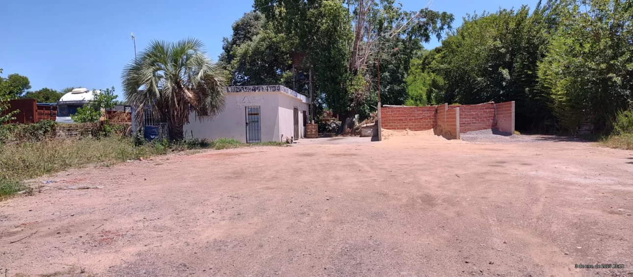 Campo de 2.4Has con 600m2 de galpones sobre Panamericana